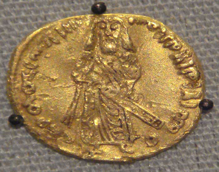 Coin of the Umayyad Caliphate, based on a Sassanian prototype. Copper falus, Aleppo, Syria, circa 695.